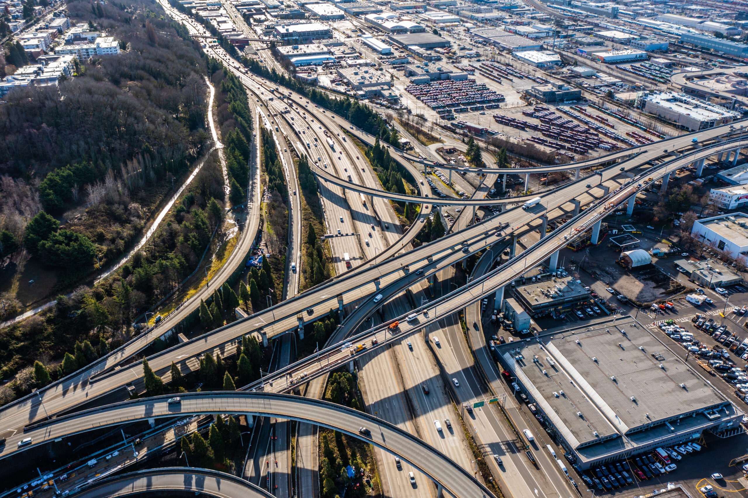 Aerial view of Highway 5 Interchange, located south of Seattle Downtown near the Stadion,  with lots of Car and Truck traffic driving in all directions