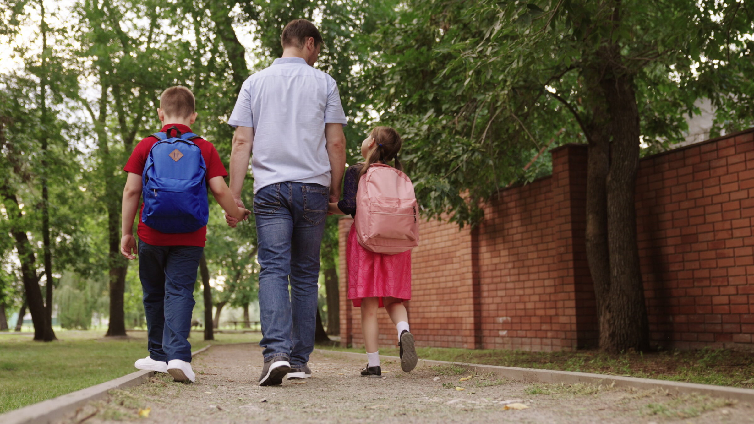 Father taking kids to school